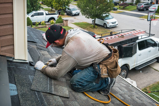 Professional Emergency Roof Repair technician working in Bloomington, IL